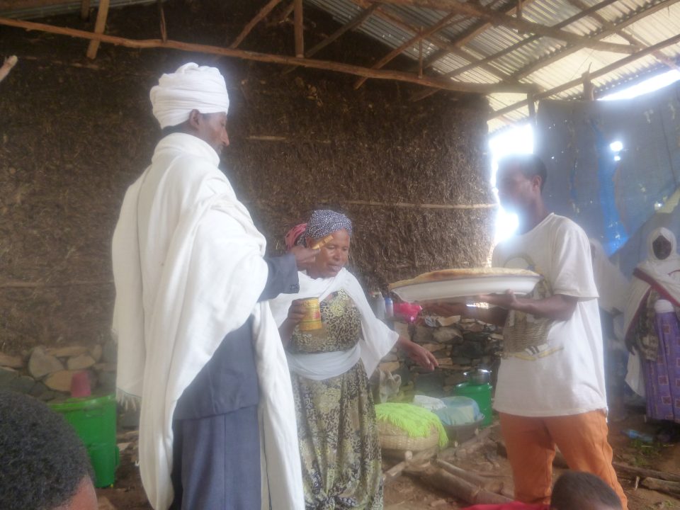 Community meeting, blessing of the bread before the feast