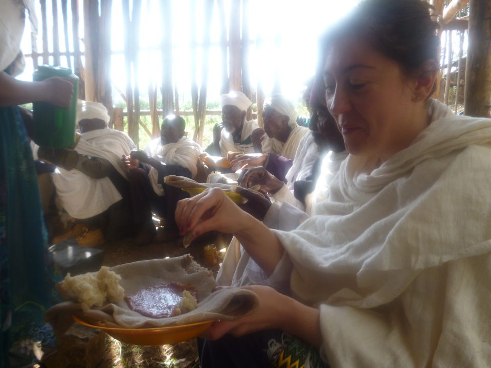 Eating to praise saints and receive blessings, meeting in a built structure in a church forests